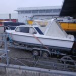 Onedin motorboot opruimen ophalen slopen afvoeren